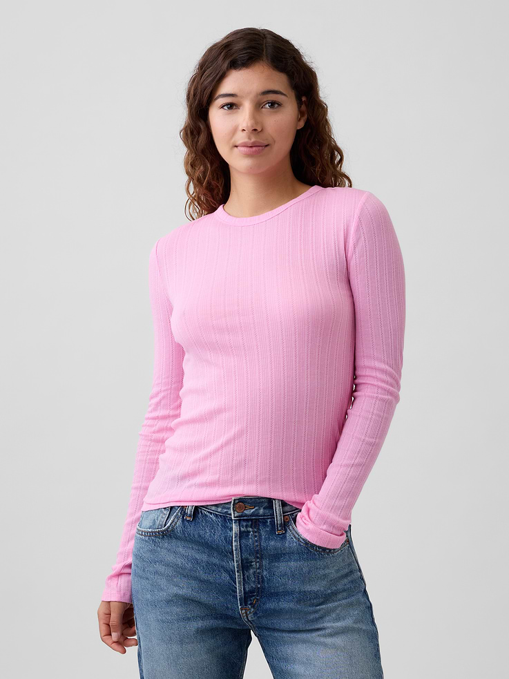 Image 1 of 5, Soft ribbed knit with pointelle detailing., Long sleeves., Crewneck., This product was made in a factory that invests in gender equity and women’s empowerment through RISE. Learn more at gapinc.com/equity., Product #855716