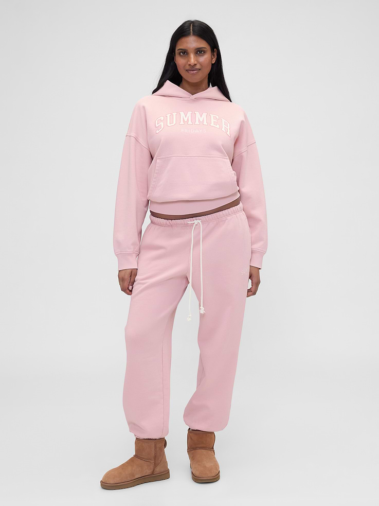 Image 1 of 6, Summer Fridays is a California beauty brand, known for its simplicity and ease. Made for the skin and the senses. We’ve partnered on this collection, bringing Summer Fridays together with Gap’s lounge essentials. Designed to unwind in., Soft, heavyweight fleece joggers. In a relaxed fit., Elasticized waist with drawcords., Slant pockets., Summer Fridays embroidered logo at thigh., Elasticized hems., Made with 14% recycled polyester. Compared to virgin materials, using recycled materials helps reduce resource use and waste., Product #856413
