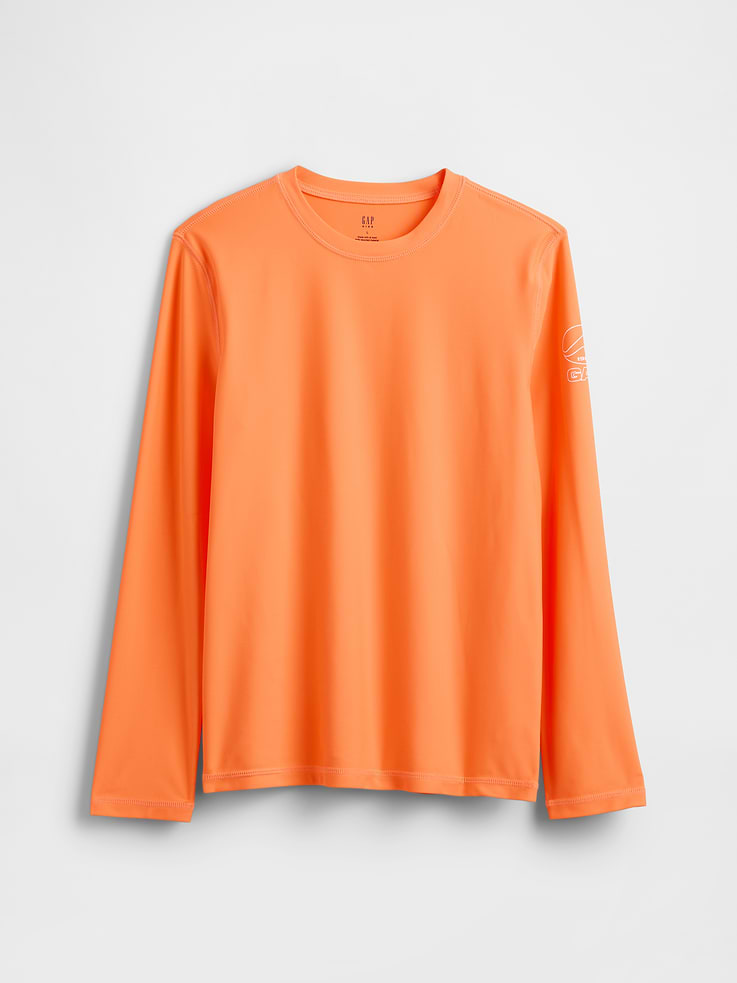 Image 1 of 3, Soft stretch swim knit rash guard., Crewneck., Long sleeves., Gap logo at sleeve., UPF 50+: Excellent UV Protection., Accords with ASTM Standard D6603., Made with 82% recycled polyester. Compared to virgin materials, using recycled materials helps reduce resource use and waste., This product was made in a factory that invests in gender equity and women’s empowerment through RISE. Learn more at gapinc.com/equity ., Product #887326