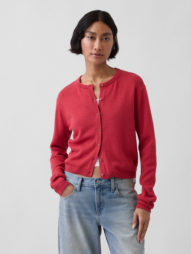 Image 1 of 5, Soft knit cotton cardigan sweater. In a relaxed fit and cropped length., Crewneck., Long sleeves., Button front., Ribbed hem., Certain styles have allover stripes., This product was made in a factory that invests in gender equity and women’s empowerment through RISE. Learn more at gapinc.com/equity ., Product #881635