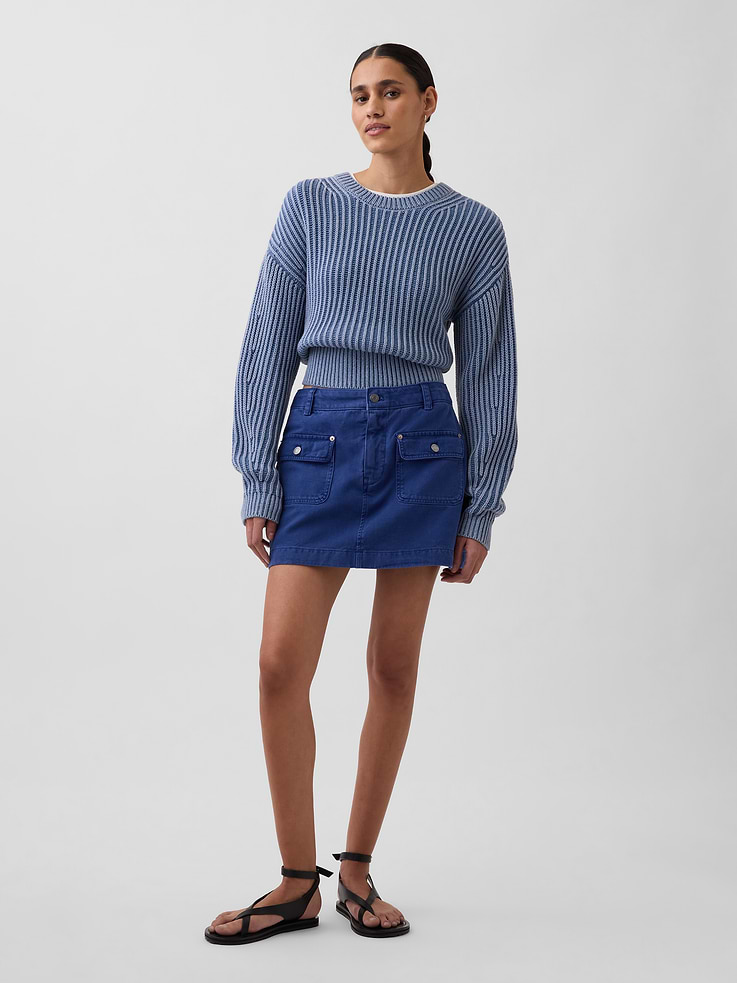 Image 1 of 6, Authentic non-stretch twill cotton cargo mini skort in an ultra mini length., Button closure, zip fly., Front snap button-flap patch pockets., Inner lightweight cotton shorts., This product was made in a factory that invests in gender equity and women’s empowerment through RISE. Learn more at gapinc.com/equity ., Product #877702