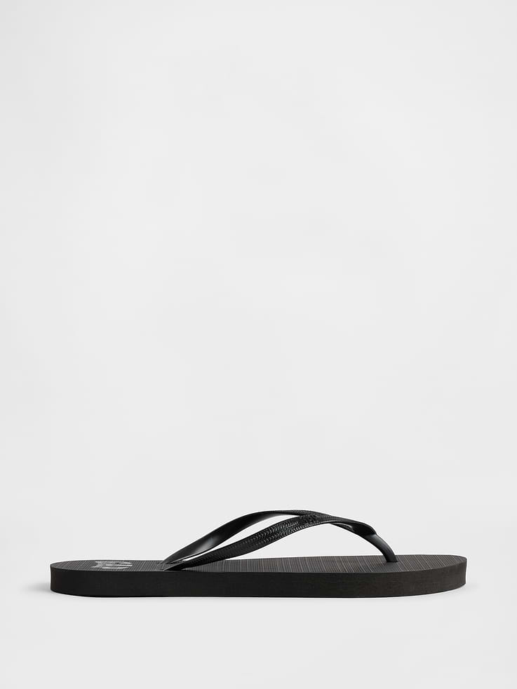 Image 1 of 5, Treaded rubber sole., Rubber straps., Gap logo at footbed., This product is not recyclable., This product was made in a factory that invests in gender equity and women’s empowerment through RISE. Learn more at, Product #1174172