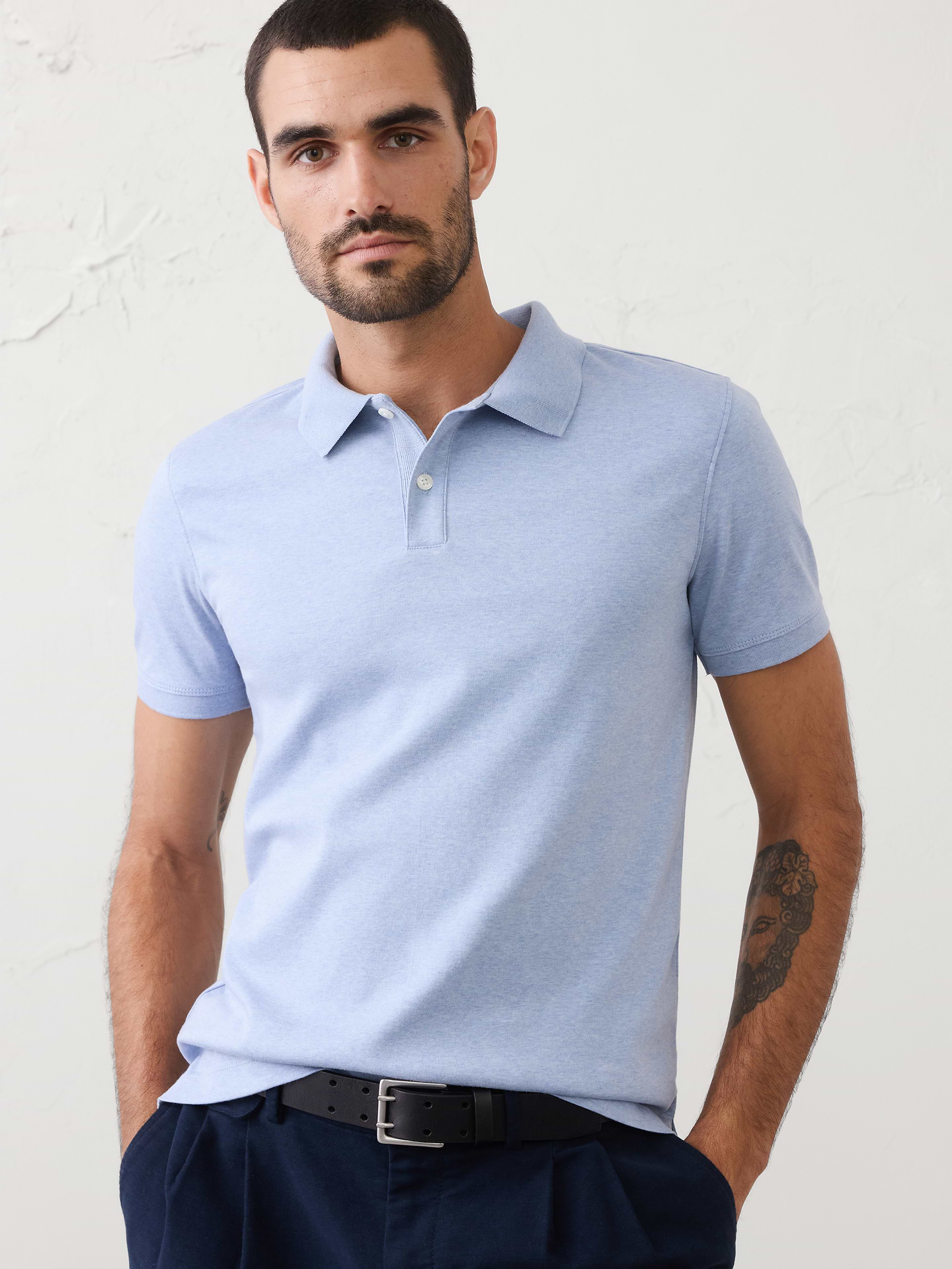 Image 1 of 8, Made with 100% cotton interlock, which is extremely soft, firm, and absorbent. Mercerization treatment gives this fabric a silk-like lustrous appearance for a polished look and hand feel, adding strength and reducing shrinkage., Polo collar with button placket. Short sleeves., Straight hem with side vents., Made exclusively for Banana Republic Factory., Product #667136
