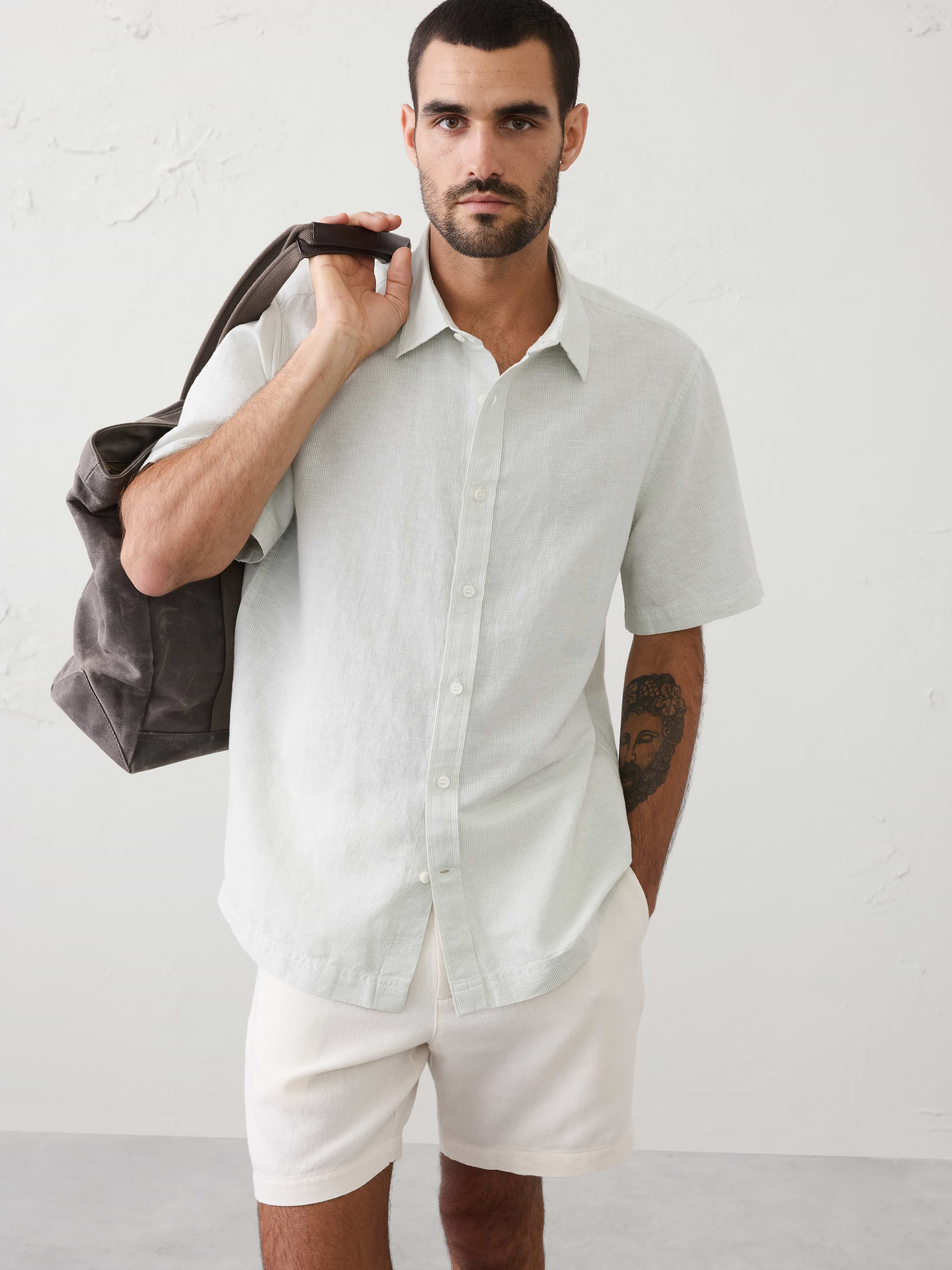 Image 1 of 8, LINEN-BLEND: This light and breathable fabric is a must for those warm days and styles effortlessly for all occasions., Stand collar. Short sleeves., Button front closure., Back yoke., Straight hem with side seam vents., Made exclusively for Banana Republic Factory., Product #854585
