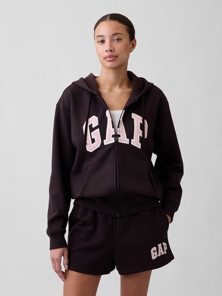 Image 1 of 5, Soft, comfy fleece., Dropped shoulder, long sleeves with banded cuffs., Drawcord ties at hood, zip front., Gap logo at front., Kanga pockets., Banded hem., Note: The dye used in the crafting of this product is prone to crocking, or color transfer. Please avoid contact with light-colored fabric or upholstery., Product #627454