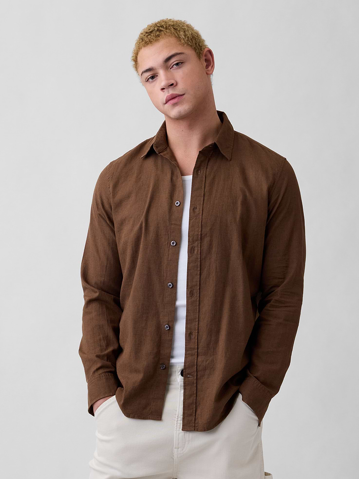 Image 1 of 5, Smooth linen blend., Long sleeves with button cuffs., Spread collar, button front., Curved shirttail hem is longer at back., Select styles have allover print or stripes., This product was made in a factory that invests in gender equity and women’s empowerment through RISE. Learn more at, Product #1172696