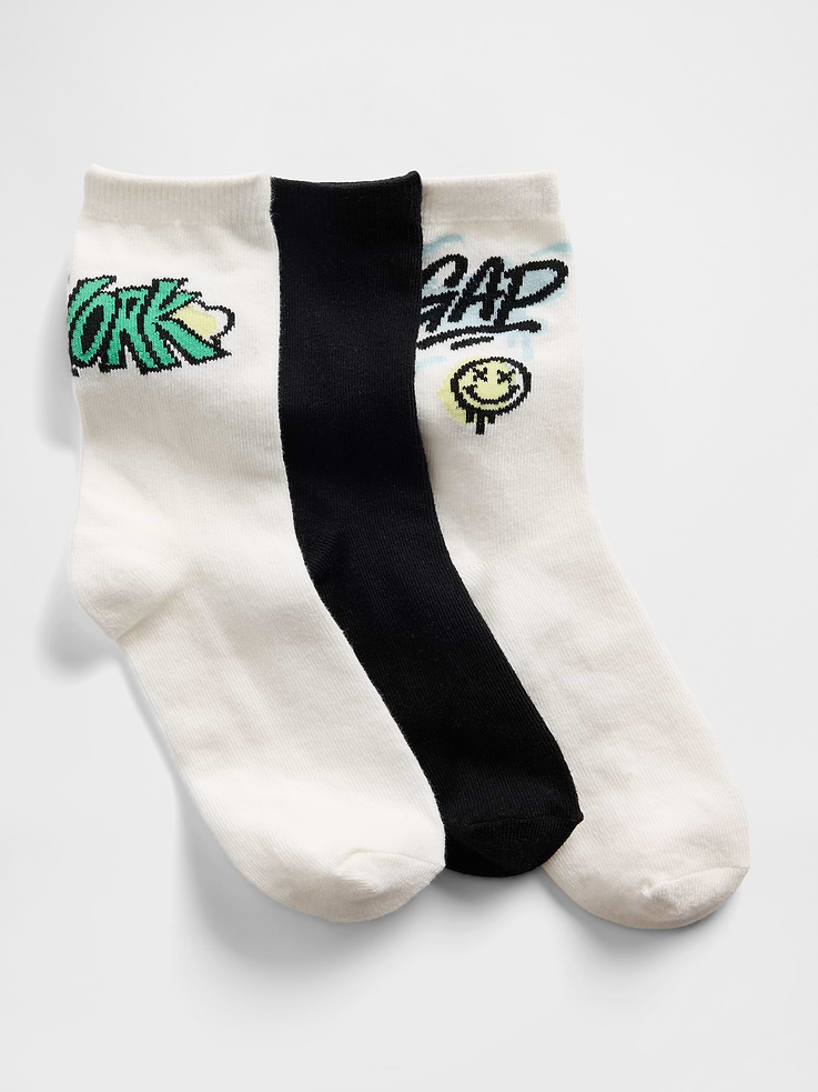 Image 1 of 2, Soft stretch knit crew socks., Ribbed top., Reinforced toe and heel., Assorted colors & graphics., Certain styles have a Gap logo at side., This product was made in a factory that invests in gender equity and women’s empowerment through RISE. Learn more at gapinc.com/equity ., Product #886734