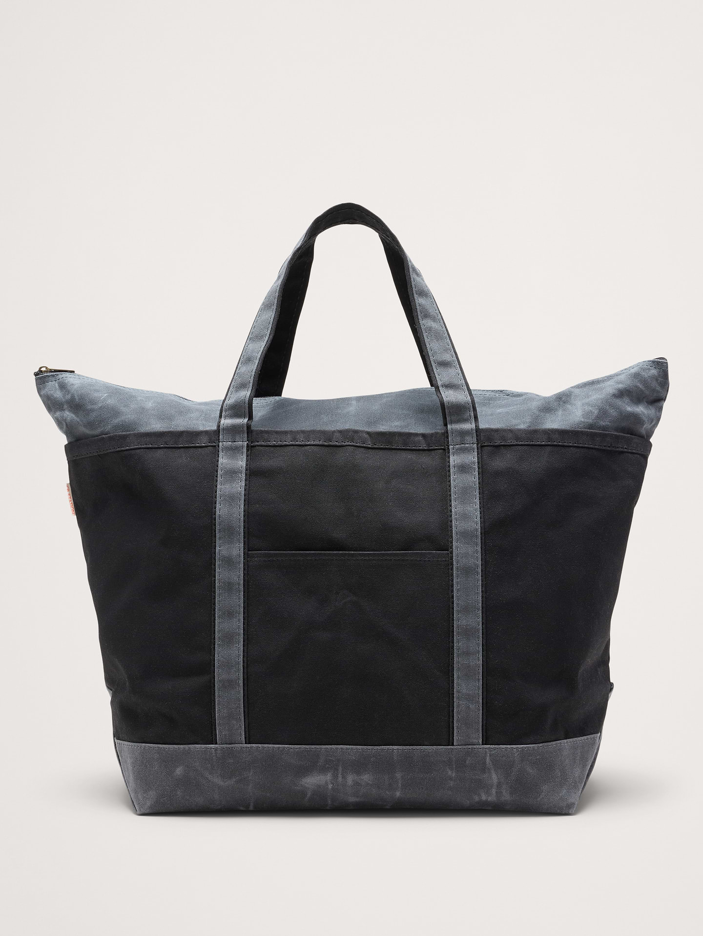 Image 1 of 5, Cut from sturdy 18-oz. cotton canvas, this classic tote is finished with a waxed coating that protects it from the elements and develops a rich patina with use. Plus, it has an outer pocket for easy access to phones, keys, cards, etc., CB Station: Georgia-based, woman-owned brand crafting eco-conscious canvas bags with timeless design and artisanal heritage., Zip top closure., Internal zip pocket with slip pockets., External slip pockets., Fully lined., Product #856387