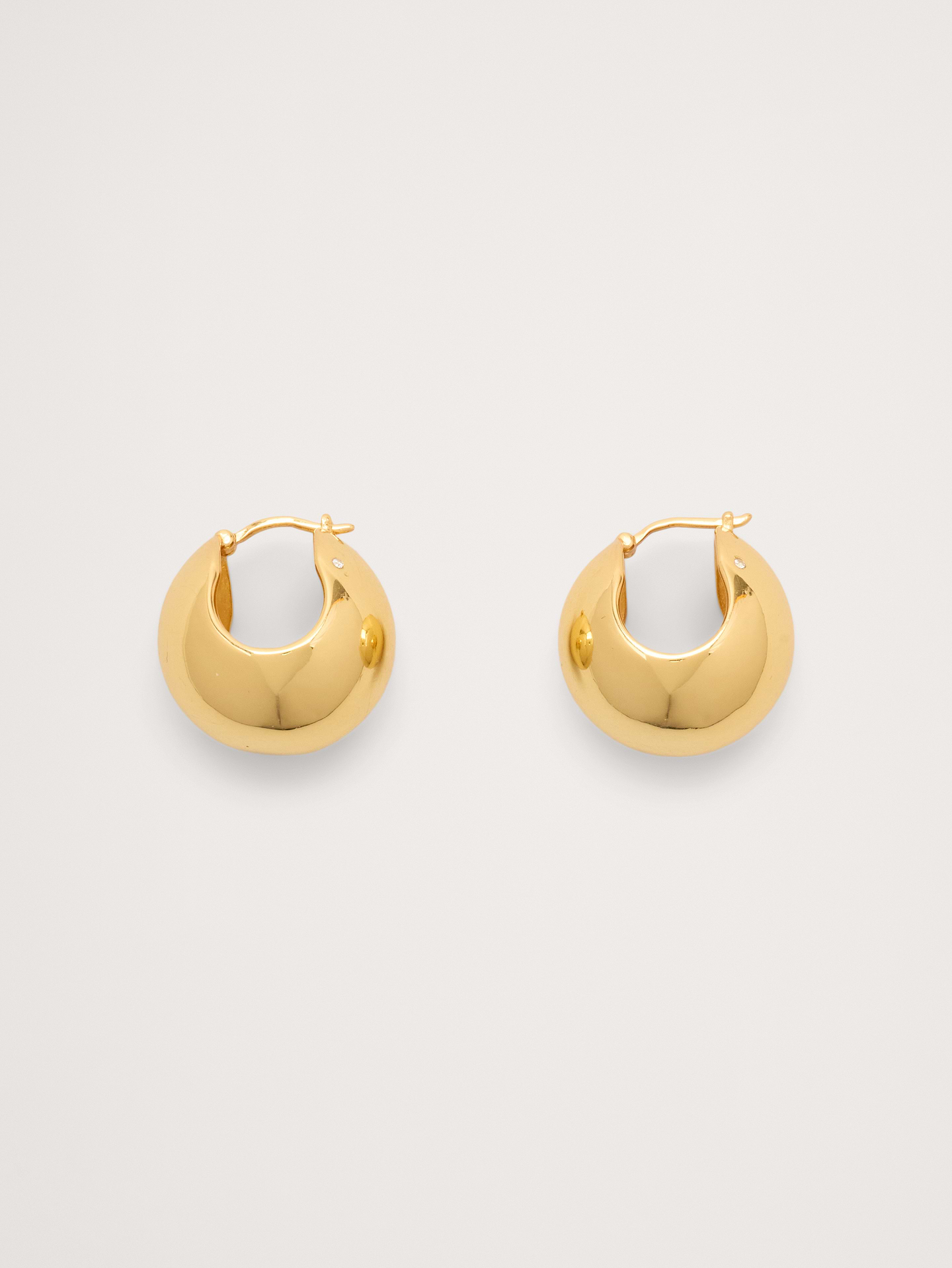 Image 1 of 5, Simple, yet statement-making, these bubble hoop earrings have a hollow construction (so they're light enough for all-day wear), in your choice of 14k-gold or 999-silver plated brass., 14k-gold or 999-silver plated brass., Post backs., Product #894358