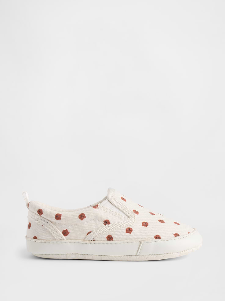 Image 1 of 5, Smooth canvas upper with interior jersey lining., Allover Brannan Bear print., Treaded rubber sole., This product was made in a factory that invests in gender equity and women’s empowerment through RISE. Learn more at gapinc.com/equity., Product #1172701