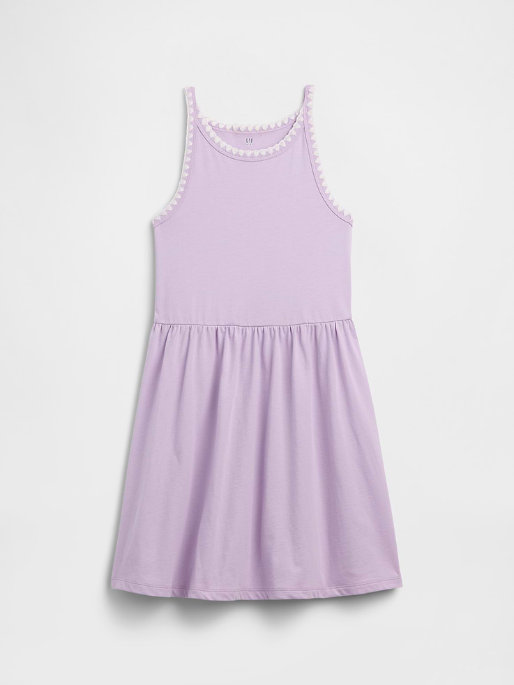 Image 1 of 3, Soft jersey knit., Tank straps., Round neckline., Shirring at waist., Select styles have allover print., This product was made in a factory that invests in gender equity and women’s empowerment through RISE. Learn more at, Product #1175261