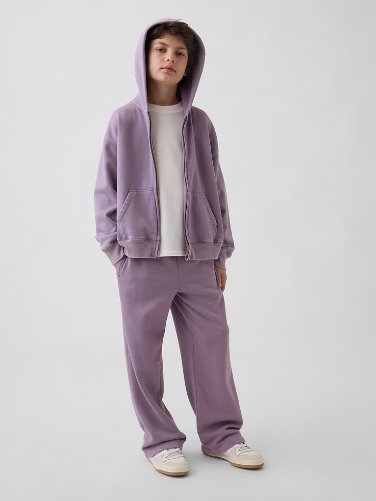 Image 1 of 5, Our softer than soft sweats. Brushed on the inside. Smooth on the outside. Made so that no two are alike., Soft cotton-blend fleece sweatpants in a relaxed fit., Elasticized waist with inner drawcords., Side welt pockets, back patch pocket., Made with 23% recycled polyester. Compared to virgin materials, using recycled materials helps reduce resource use and waste., This product was made in a factory that invests in gender equity and women’s empowerment through RISE. Learn more at gapinc.com/equity ., Product #887320