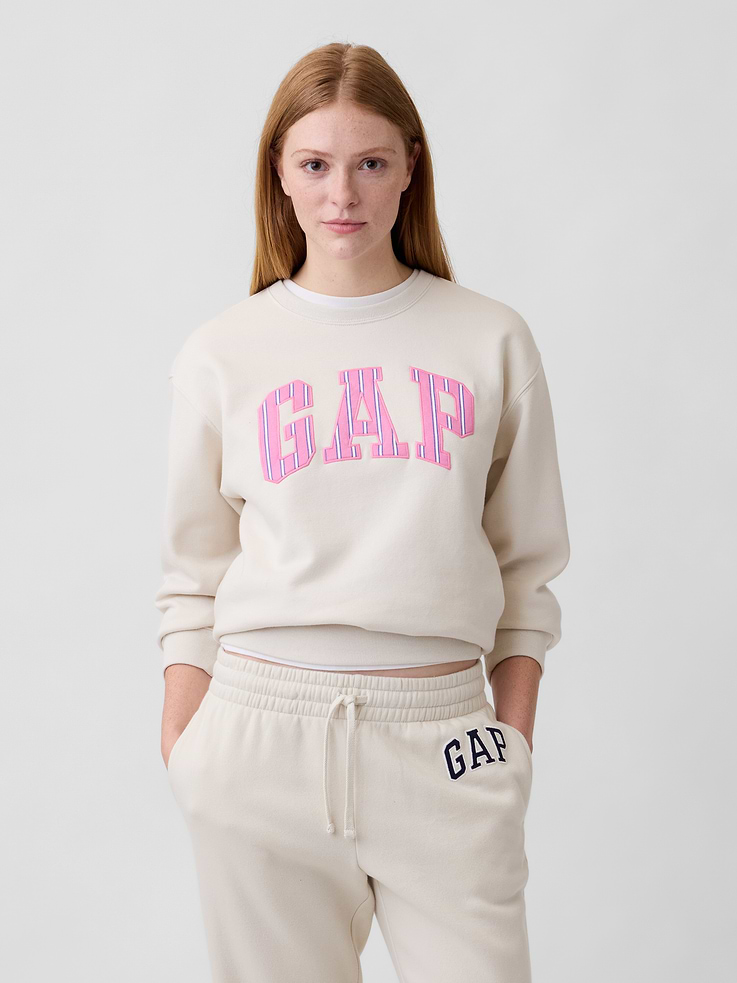 Image 1 of 4, Soft, comfy fleece., Long sleeves with banded cuffs., Crewneck., Gap logo at front., Banded hem., Product #1172777