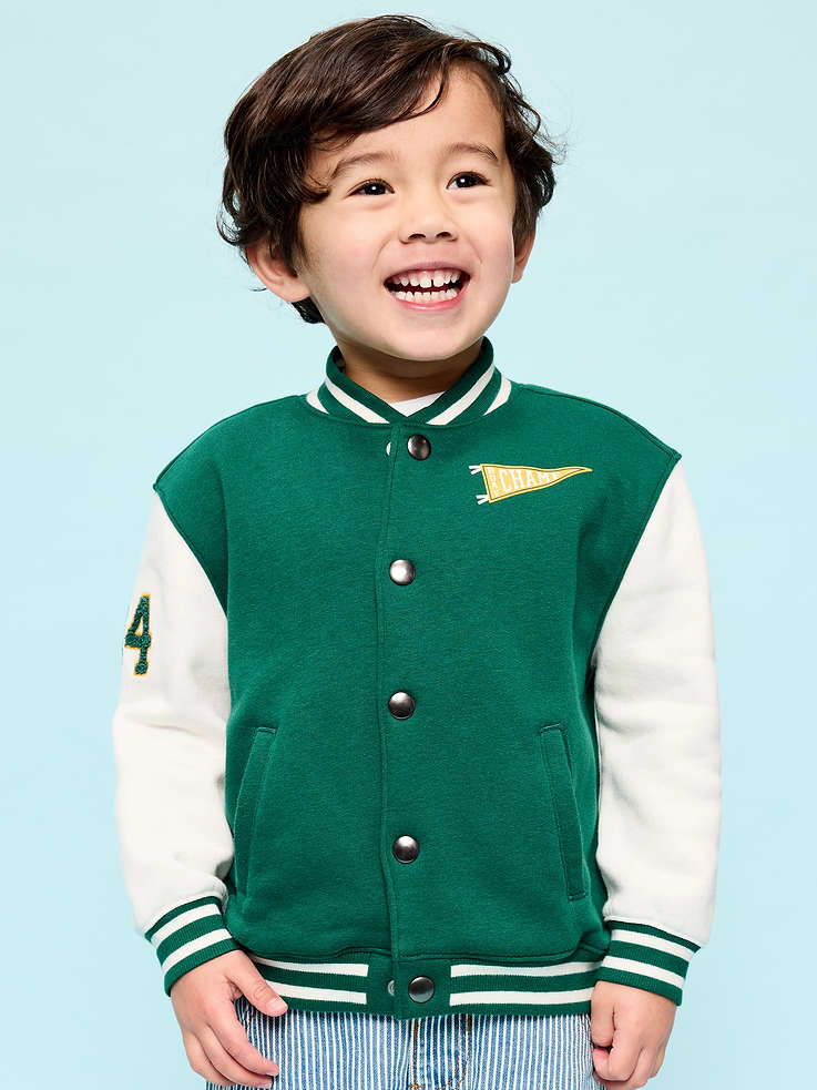Image 1 of 3, standing rib-knit collar, long sleeves, full-length snap-button placket, diagonal welt pockets at front, embroidered patch at chest, rib-knit hem, Product #885581