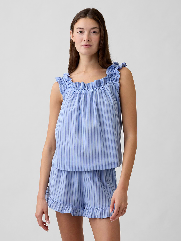 Image 1 of 5, Smooth poplin sleep top., Ruffle trim at elasticized tank straps., Ruffle trim at square neckline., Shirring at yoke., Select styles have allover print or stripes., This product was made in a factory that invests in gender equity and women’s empowerment through RISE. Learn more at, Product #1173341
