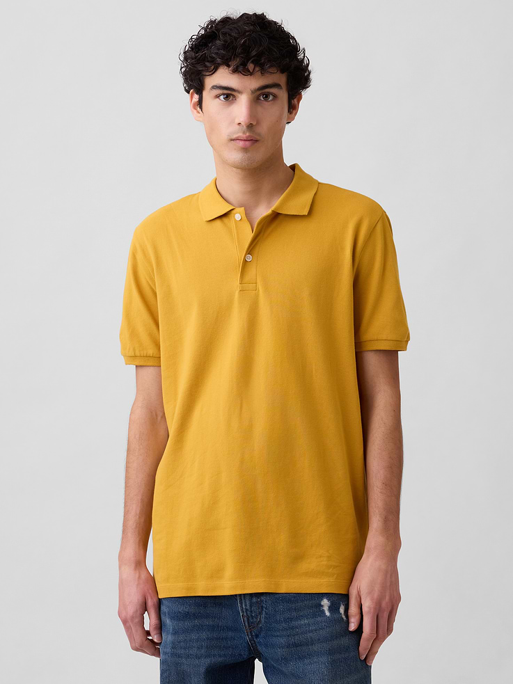 Image 1 of 5, Stretch pique knit., Short sleeves., Spread collar, henley button front., Slits at hem., Note: The dye used in the crafting of this product is prone to crocking, or color transfer. Please avoid contact with light-colored fabric or upholstery., This product was made in a factory that invests in gender equity and women’s empowerment through RISE. Learn more at, Product #547250