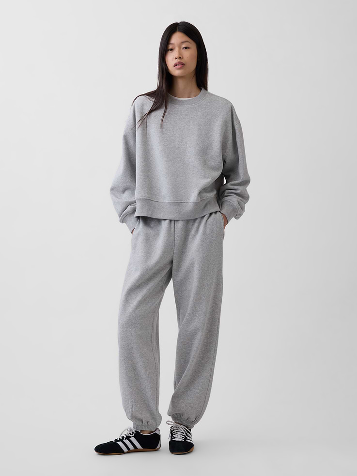 Image 1 of 6, Our softer than soft sweats. Brushed on the inside. Smooth on the outside. Made so that no two are alike., Soft cotton-blend fleece baggy joggers., Elasticized waist with inner drawcords., Side on-seam pockets., Elasticized cuffs., Made with 23% recycled polyester. Compared to virgin materials, using recycled materials helps reduce resource use and waste., Explore our GapSweats Guide ., Product #903058