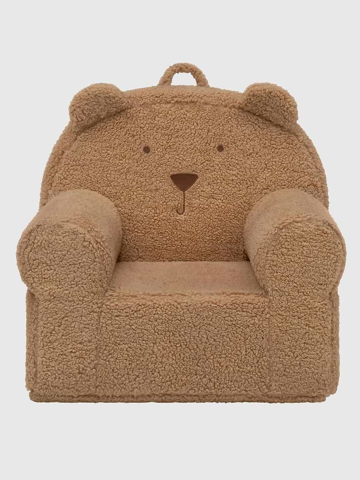 Image 1 of 2, Delight your little cub with this babyGap by Delta Children Sherpa Bear Chair., Kids will love reading, relaxing and cuddling in their very own chair, covered in plush sherpa and embellished with a sweet teddy bear face and fluffy ears., Designed with a kid-friendly handle, your child can easily tote this chair around the house., A delightful addition to playrooms and nurseries, this chair is designed to for serious play, its removable and machine washable slipcover ensures it will look great for many years., This product is Greenguard Gold certified to meet stringent chemical emissions standards., Recommended for ages 18 months to 6 years., Holds up to 100 lbs.