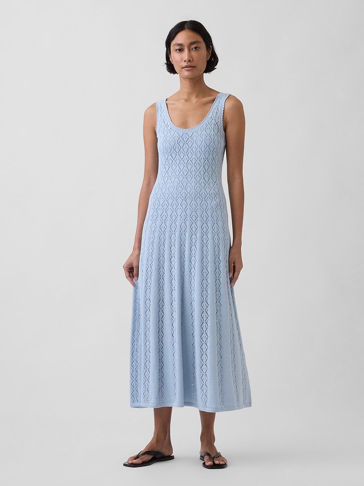Image 1 of 6, Soft pointelle knit cotton maxi dress., Scoop neck., Tank straps with hidden snaps at shoulders to hold slip lining in place., Ribbed hem., Removable jersey slip lining., This product was made in a factory that invests in gender equity and women’s empowerment through RISE. Learn more at gapinc.com/equity ., Product #879069