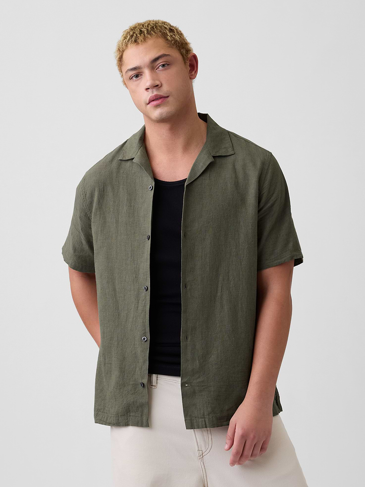 Image 1 of 5, Smooth linen blend., Short sleeves., Notch spread collar, button front., Slits at hem., Select styles have allover print or stripes., This product was made in a factory that invests in gender equity and women’s empowerment through RISE. Learn more at, Product #878722