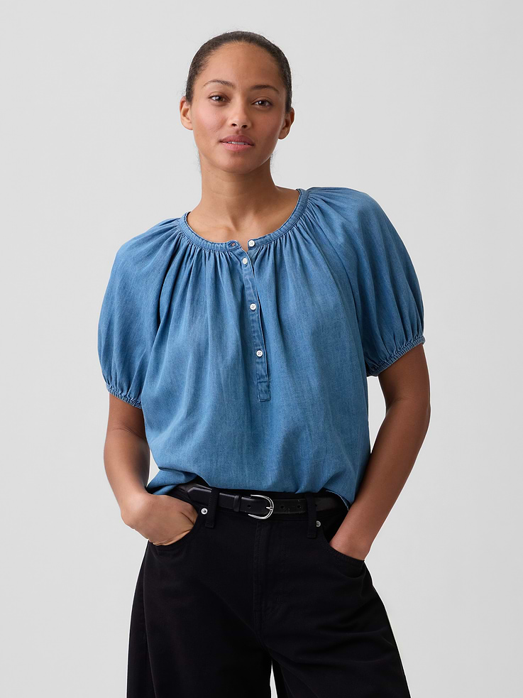 Image 1 of 5, Smooth voile weave., Elbow-length puff sleeves with elasticized cuffs., Shirring at round neckline, half-button front., Select styles have allover print., This product was made in a factory that invests in gender equity and women’s empowerment through RISE. Learn more at, Product #1172475