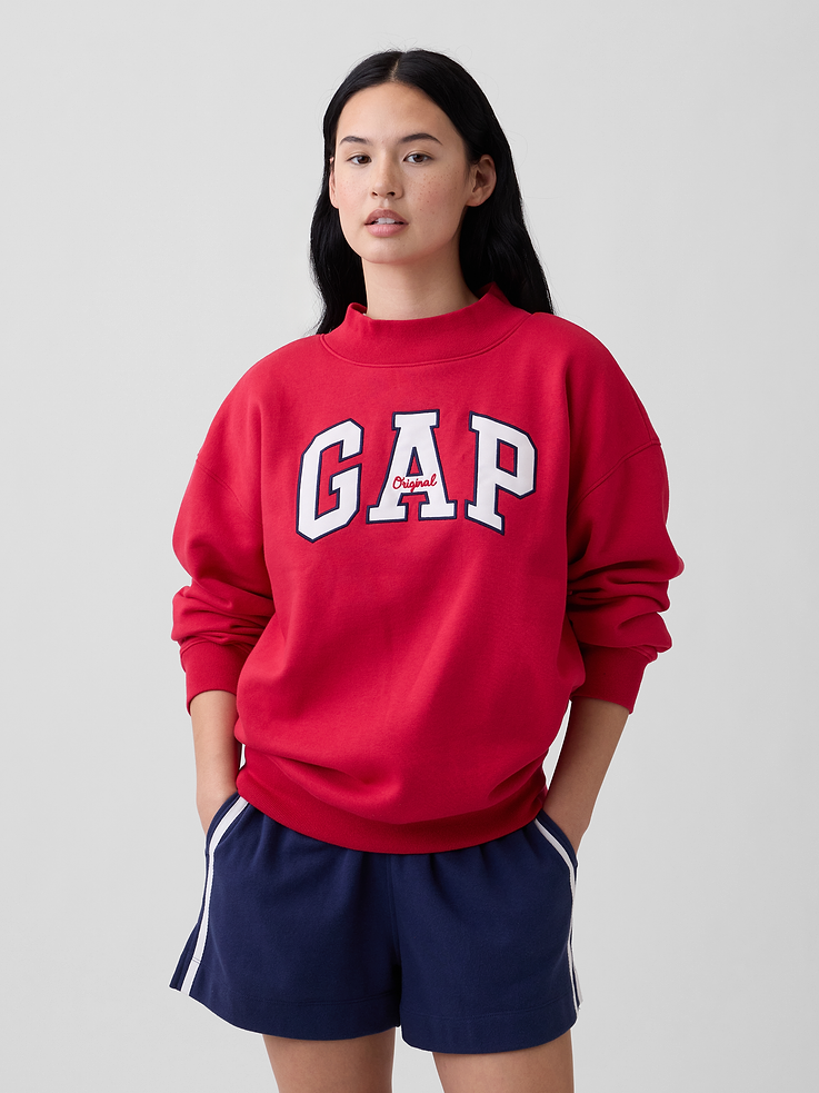 Image 1 of 5, This style is made with 23% recycled polyester. Compared to virgin materials, using recycled materials helps to reduce resource use and waste., Soft, comfy fleece., Dropped shoulder, long sleeves with banded cuffs., Mockneck., Gap logo at front., Banded hem., This product was made in a factory that invests in gender equity and women’s empowerment through RISE. Learn more at, Product #1174684