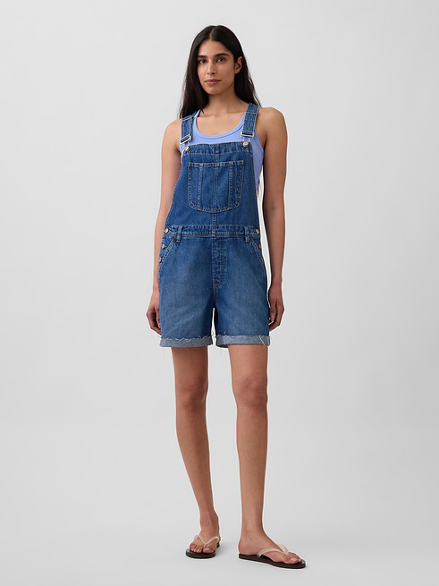 Woman wearing loose denim shortalls from GAP