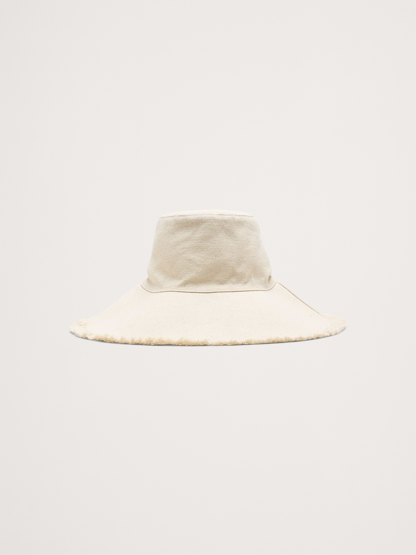 Image 1 of 3, This lightweight and breathable sun hat is made from a linen-cotton blend with fringe details—the ideal piece for warm weather., Hat Attack: Crafting sustainable, stylish hats & accessories since 1981. Family-run, with modern designs rooted in artisanal heritage., Product #914671