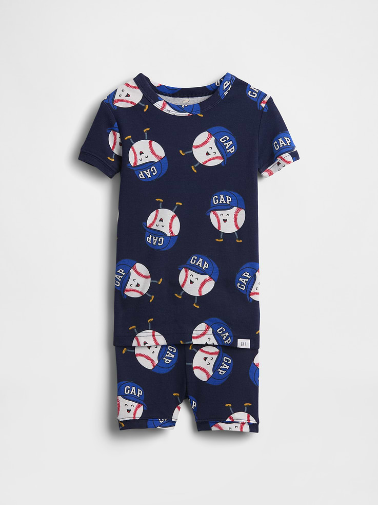 Image 1 of 2, Our comfiest PJs—now softer than ever. Cozy brushed cotton on the inside. All their favorite prints & colors on the outside., Soft cotton pajama top and shorts set with a cozy brushed interior., Crewneck., Short sleeves., Elasticized waist at PJ shorts., Allover print featuring baseball in Gap arch logo cap., Made with 100% organically grown cotton which is grown without the use of synthetic pesticides and fertilizers., Product #884594