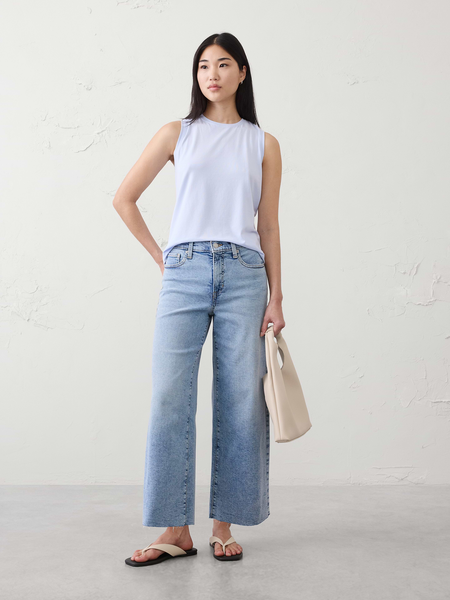 Image 1 of 8, Introducing our latest addition: the new Timeless Tank crafted from our bestselling Timeless fabric. This muscle silhouette combines classic sophistication with contemporary flair., Crew neck., Straight hem., Made exclusively for Banana Republic Factory., Product #885458