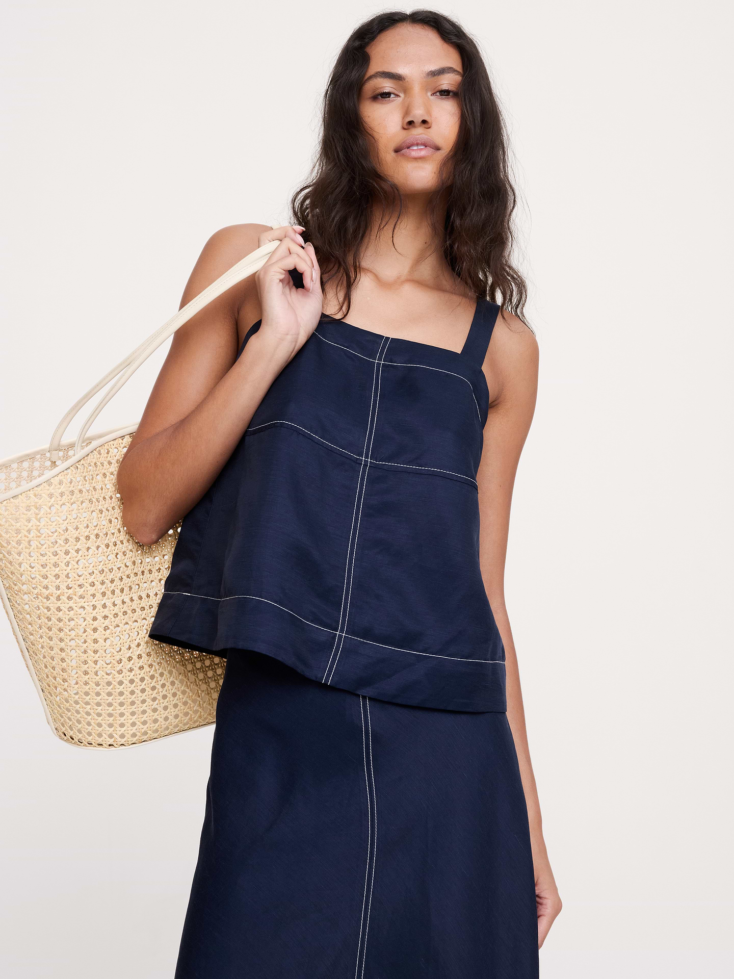 Image 1 of 8, Designed for warm weather, this trapeze tank is expertly cut from a luxuriously soft fabric that mixes silky viscose rayon and breathable linen. Plus, we added a contrasting top-stitch detail as a nod to our heritage of utilitarian design., Classic Fit: A straight and easy fit., Square neck with adjustable slider straps., Hidden elastic at back for a custom fit., Straight hem., Product #899559