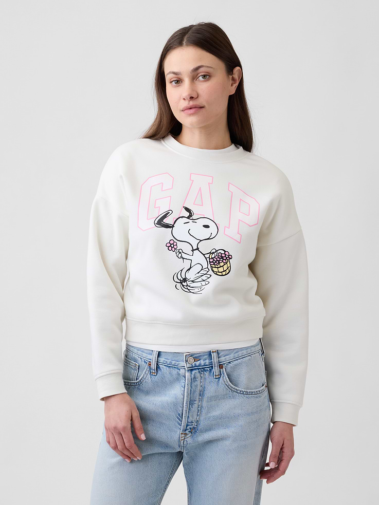 Image 1 of 5, Soft, comfy fleece., Dropped shoulder, long sleeves with banded cuffs., Crewneck., Gap logo with graphic at front., Banded wedge hem., Product #1174939