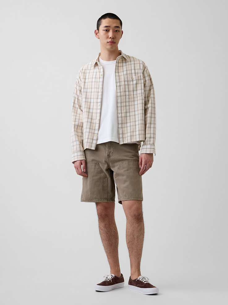 Image 1 of 7, Authentic non-stretch denim carpenter shorts in a loose fit., Button closure, zip fly., Classic five-pocket styling., Paneling detail at front., Hammer loop and utility pockets at sides., Assorted washes., Responsibly Made: This pair of denim shorts is part of our water-saving Washwell program. Compared with conventional wash methods, Washwell uses at least 20% less water., More Sustainable Cotton: Made with 100% Protocol cotton verified by the U.S. Cotton Trust Protocol, a program which works with farms committed to improving their environmental footprint by minimizing water usage and improving soil diversity (Claim No. 10127)., This product was made in a factory that invests in gender equity and women’s empowerment through RISE. Learn more at gapinc.com/equity ., Product #898962