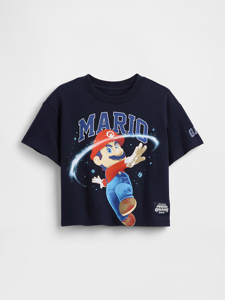 Image 1 of 3, Soft cotton jersey graphic T-shirt in an oversized fit., Crewneck., Short sleeves with drop shoulders., Assorted Super Mario Bros. character graphics with The Super Mario Galaxy movie logo at front., Gap arch logo at sleeve., This product was made in a factory that invests in gender equity and women’s empowerment through RISE. Learn more at gapinc.com/equity ., Product #877808