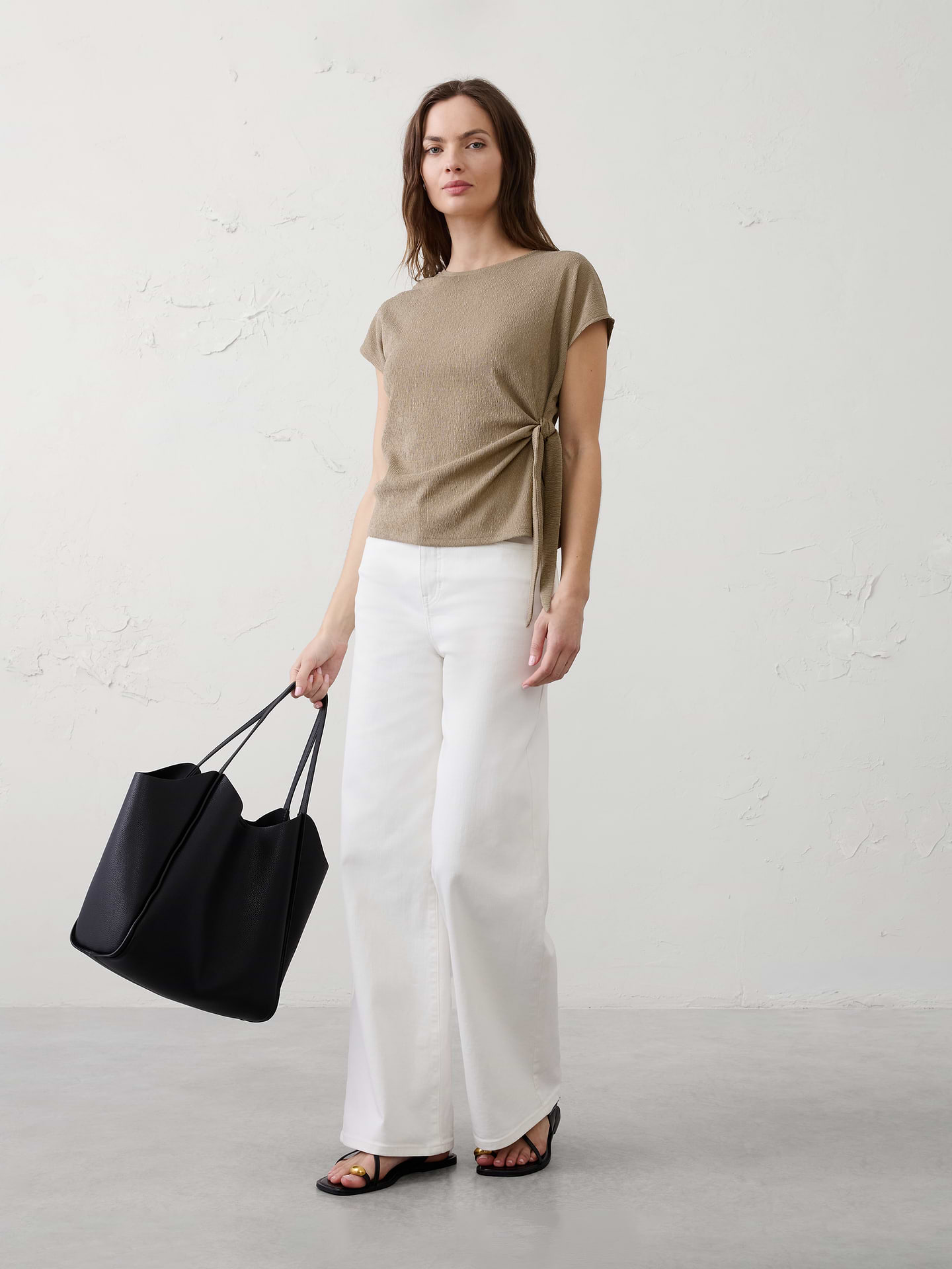 Image 1 of 4, Crafted in a novelty crinkle‑texture fabric that adds subtle dimension and elevates this easy warm‑weather top., Crew neckline. Cap sleeves., Adjustable side tie with soft gathers at the side seam., Straight hem., Made exclusively for Banana Republic Factory., Product #1174943
