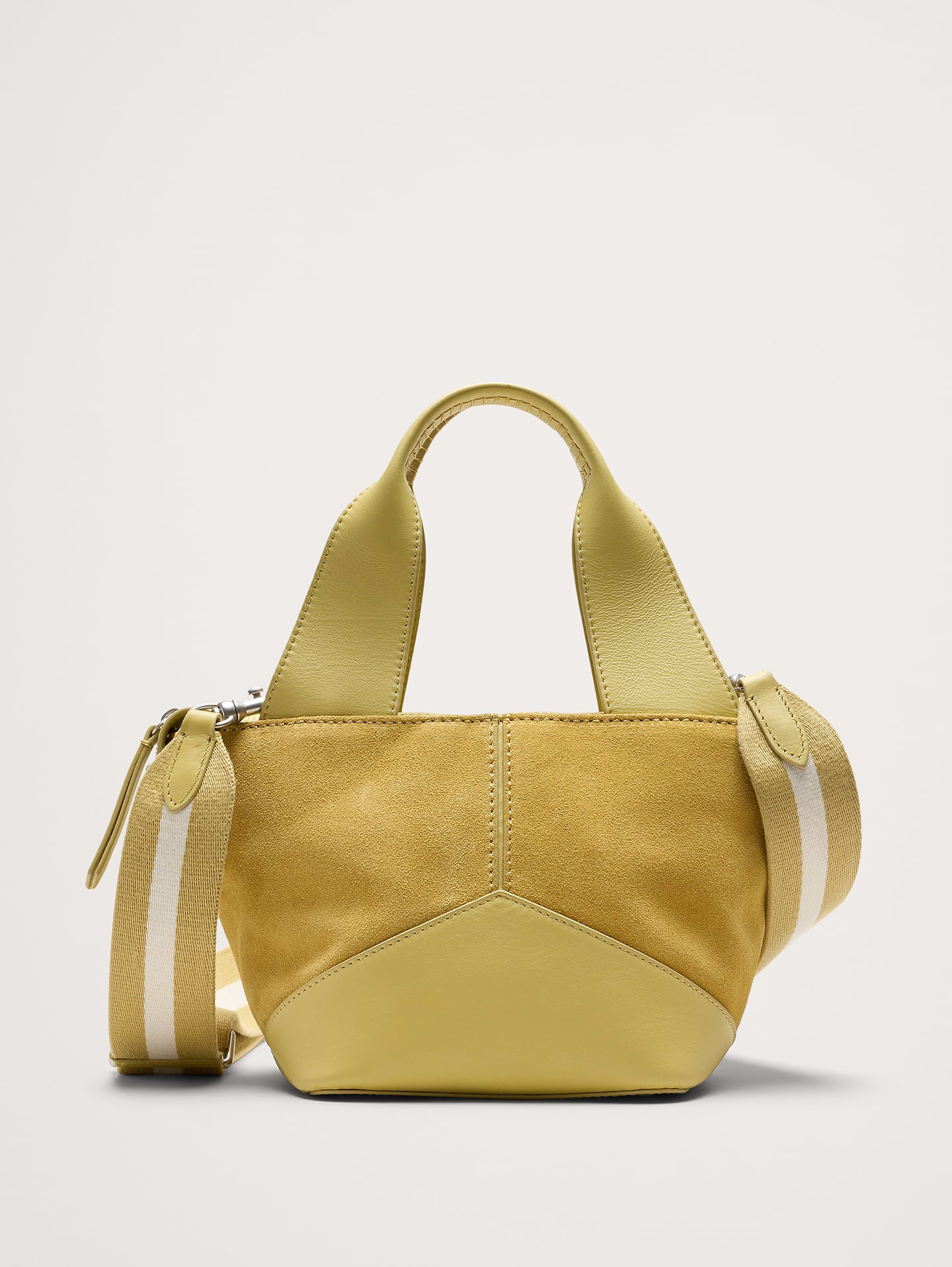 Image 1 of 8, Beautiful materials need no ornamentation. Here, a patchwork tote in a smaller scale shows off your choice of canvas or suede with beautiful leather trim., Zip top closure., Concealed slip pocket with magnetic clasp (perfect for phones, credit cards, keys…), Italian leathers and suedes., Removable shoulder strap., Fully lined., Product #825883