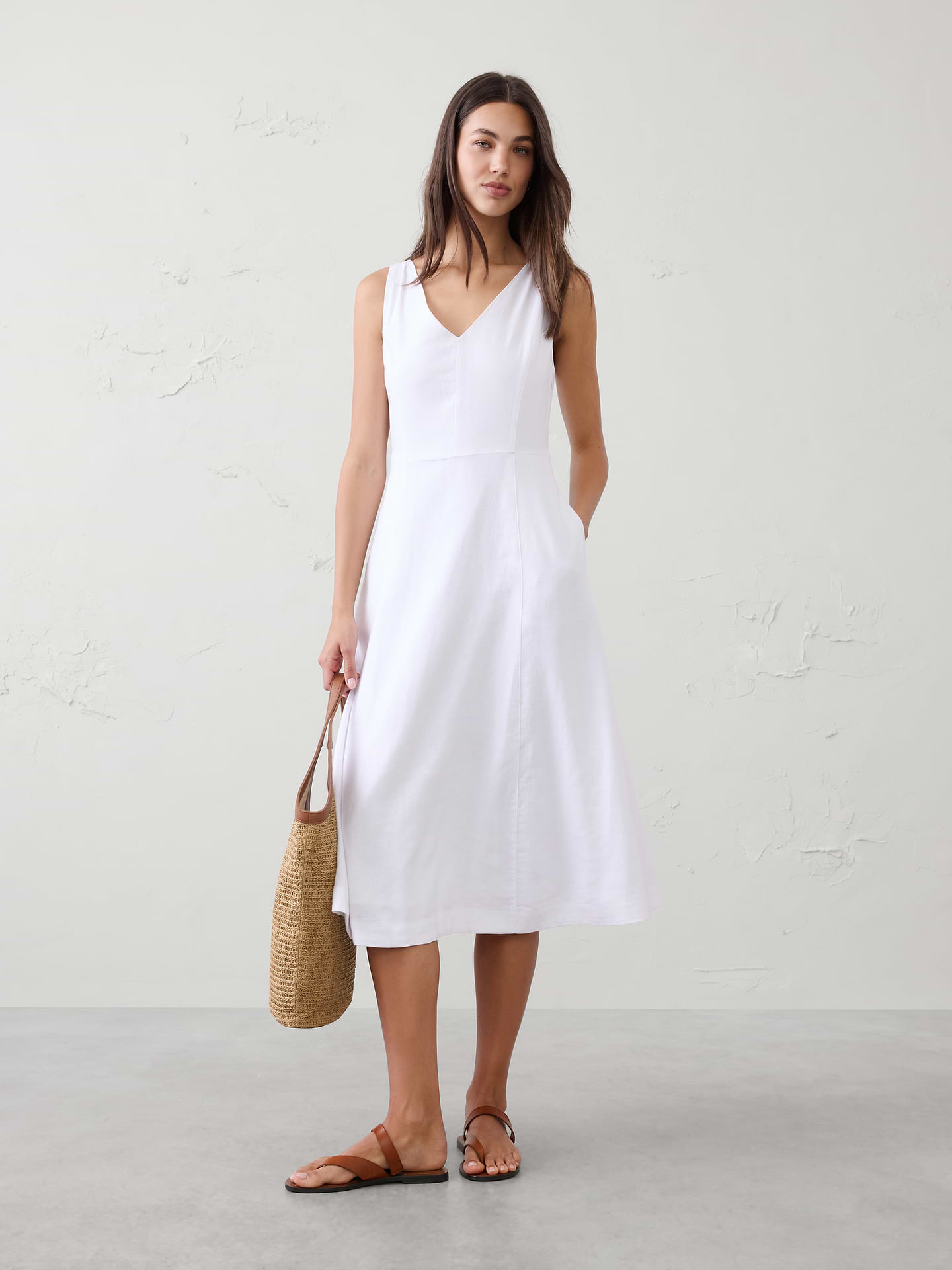 Image 1 of 4, LINEN-BLEND: This light and breathable fabric is a must for those warm days and styles effortlessly for all occasions., Front and back V‑neckline. Sleeveless., Shaped bodice for subtle waist definition., On seam pockets., Invisible left‑side zipper with hook‑and‑eye closure., Flared A‑line skirt with fluid movement., Fully lined., Made exclusively for Banana Republic Factory., Product #857679