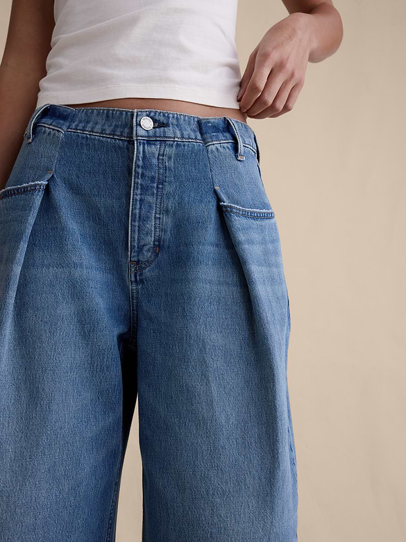 Jean ample court plissé à taille mi-basse