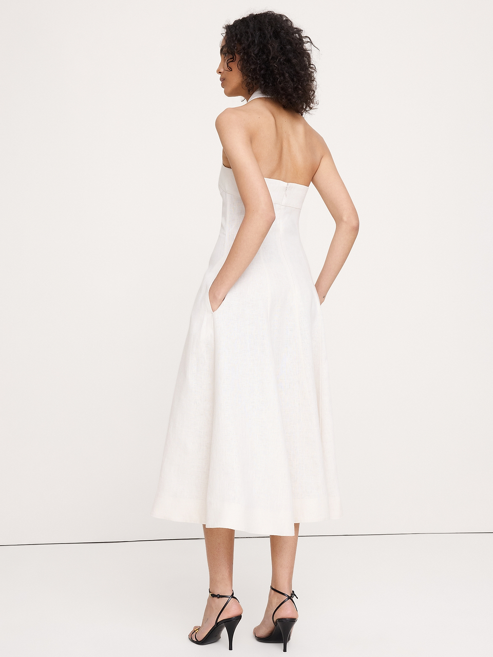 white linen halter dress Blend Neck Midi neckline Ruched torso design with slight opening Bow Bora Linen Halter Dress |