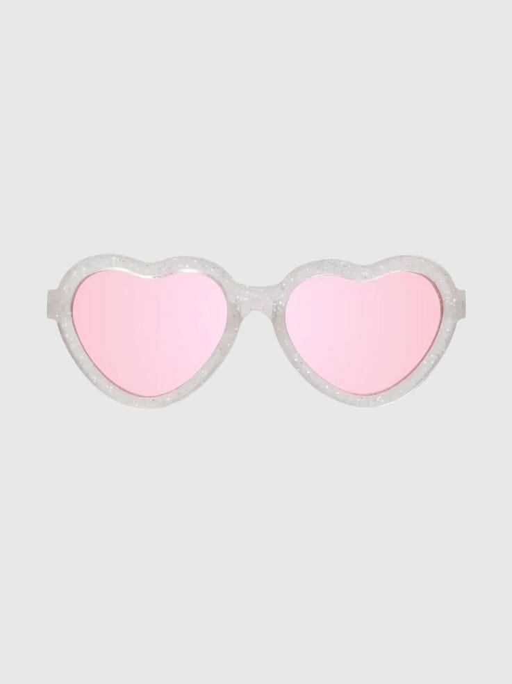 Image 1 of 3, Cue the heart eyes because with these NEW shades, it’s love at first sight!, Featuring funky fresh heart-shaped frames and transparent fuchsia lenses, these fun sunnies are a sweet surprise your little won’t want to take off., Babiators sunglasses are highly durable, featuring flexible rubber frames and impact and shatter resistant lenses that won’t break when you bend, twist, or step on them., Each pair of sunglasses comes with a microfiber storage bag that doubles as a cleaning cloth to keep your little one’s shades safe and clean.