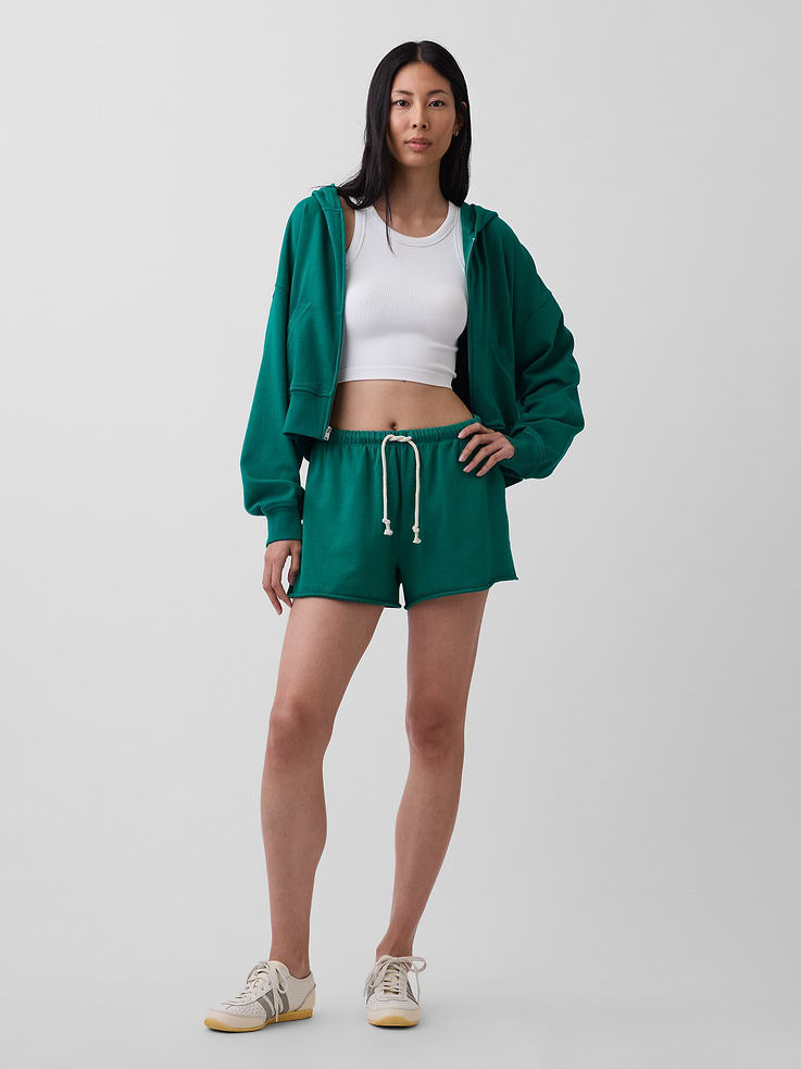 Image 1 of 7, Our signature softer than soft sweats — now in a light French Terry. Brushed outside. Textured inside. Feels better than vintage, from day one., Soft cotton-blend French terry sweat shorts in a relaxed fit., Elasticized waist with drawcords., Side on-seam pockets, back patch pocket., Raw edge hem., Explore our GapSweats Guide ., This product was made in a factory that invests in gender equity and women’s empowerment through RISE. Learn more at gapinc.com/equity ., Product #887729