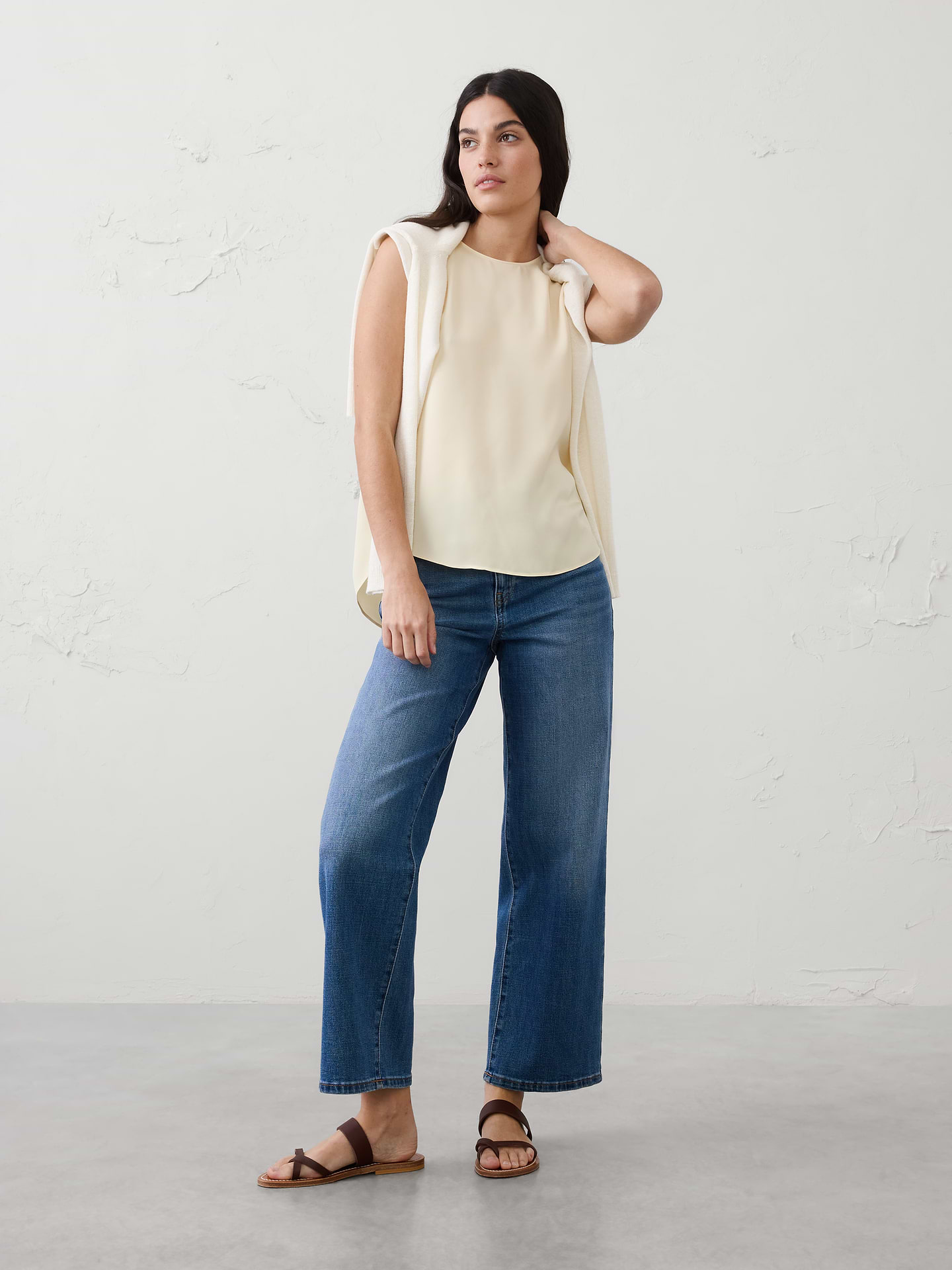 Image 1 of 8, SUSTAINABILITY: Made with 55% recycled polyester., Crew neck. Sleeveless., Side seam front detail., Key hole opening in back with button closure., High-low shirttail hem., Due to the fabric cut, each print pattern will be unique., Made exclusively for Banana Republic Factory., Product #582056