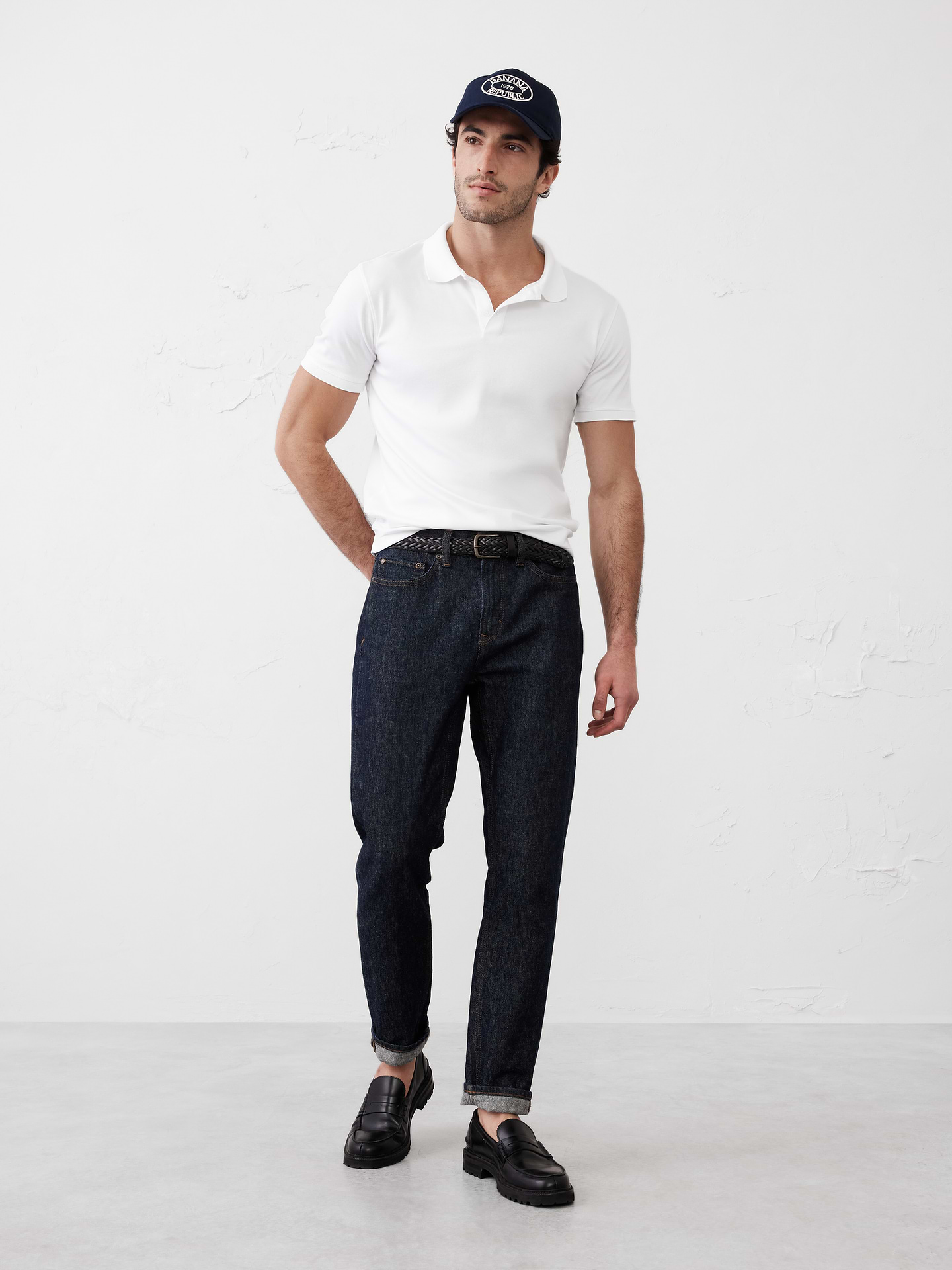 Image 1 of 8, Made with 100% cotton interlock, which is extremely soft, firm, and absorbent. Mercerization treatment gives this fabric a silk-like lustrous appearance for a polished look and hand feel, adding strength and reducing shrinkage., Polo collar with button placket. Short sleeves., Straight hem with side vents., Made exclusively for Banana Republic Factory., Product #667136