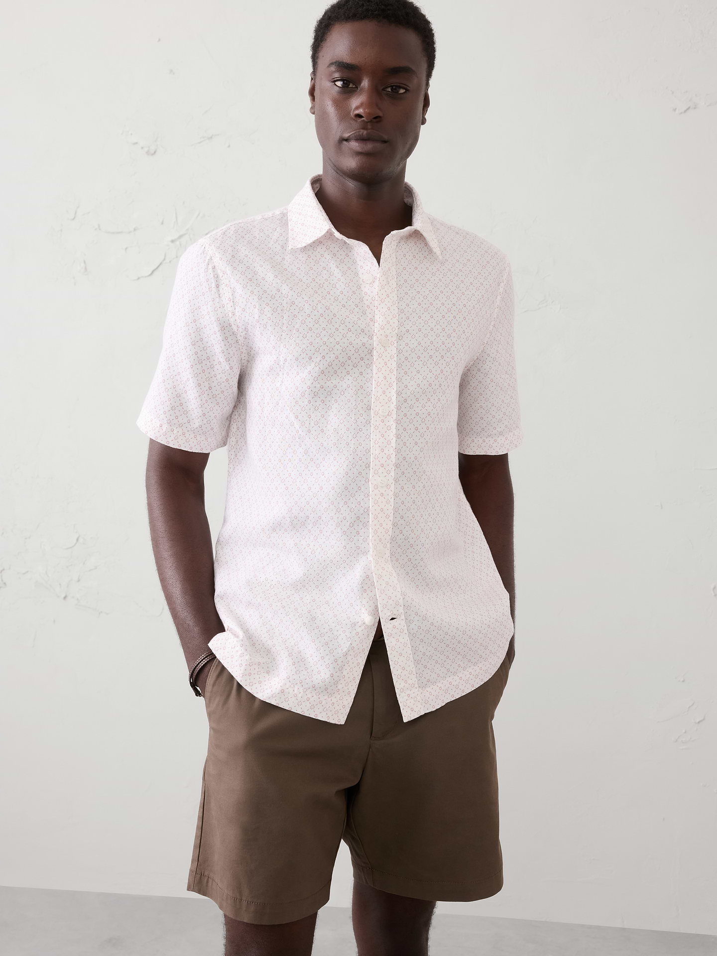 Image 1 of 8, LINEN-BLEND: This light and breathable fabric is a must for those warm days and styles effortlessly for all occasions., Stand collar. Short sleeves., Button front closure., Back yoke., Straight hem with side seam vents., Made exclusively for Banana Republic Factory., Product #854585