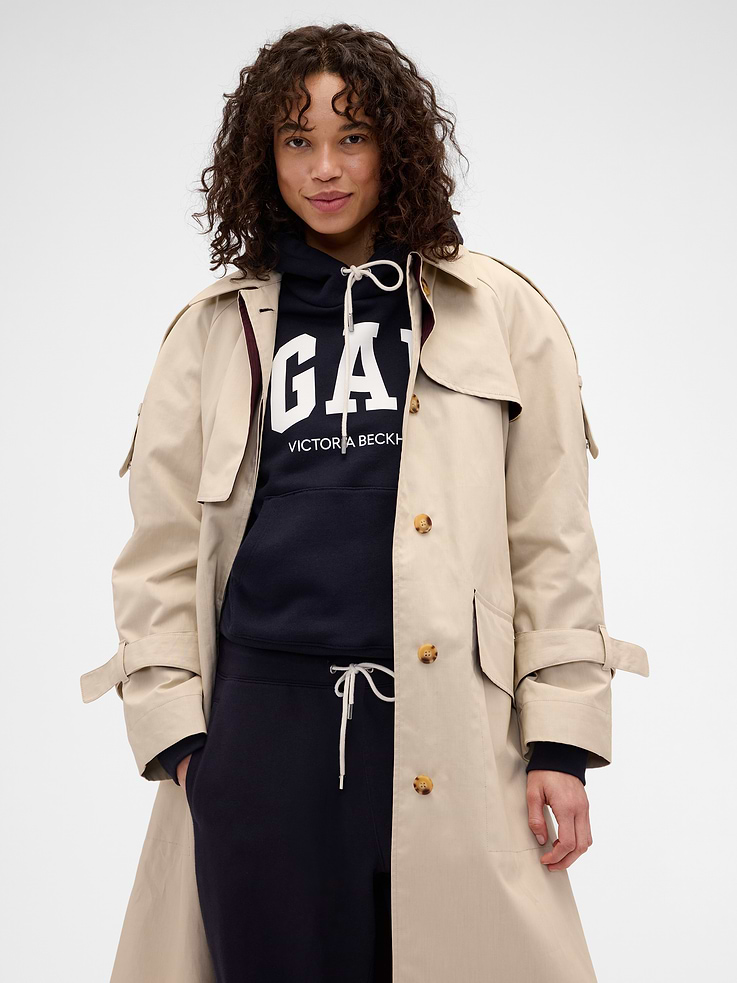 Image 1 of 7, Known for her timeless silhouettes and immaculate tailoring, Victoria Beckham's singular take on style is rooted in a sense of sophisticated ease. Through her lens, our icons take on a new form. Feminine. Powerful. Artistic. Grounded in elevated staples — and denim. The unexpected meeting of Victoria Beckham and Gap., Soft, 650-gram extra heavyweight cotton-blend hoodie. In an oversized fit., Hooded neckline with drawcords., Long sleeves., Gap x Victoria Beckham logo at chest., Kanga pocket with red stitch detailing., Banded hem and cuffs., Made with 14% recycled polyester. Compared to virgin materials, using recycled materials helps reduce resource use and waste., This product was made in a factory that invests in gender equity and women’s empowerment through RISE. Learn more at gapinc.com/equity ., Product #902785