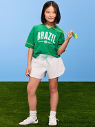 Image 1 of 3, v neck, short sleeves, drop shoulders, graphic at front, lace trim, side slits at hem, © FIFA, FIFA'S OFFICIAL LICENSED PRODUCT LOGOS, AND ALL BRAND ELEMENTS, DESIGNS AND TRADE NAMES OF FIFA AND FIFAE TOURNAMENTS, EVENTS AND PRODUCTS ARE COPYRIGHTS AND/OR TRADEMARKS OF FIFA., Product #902119