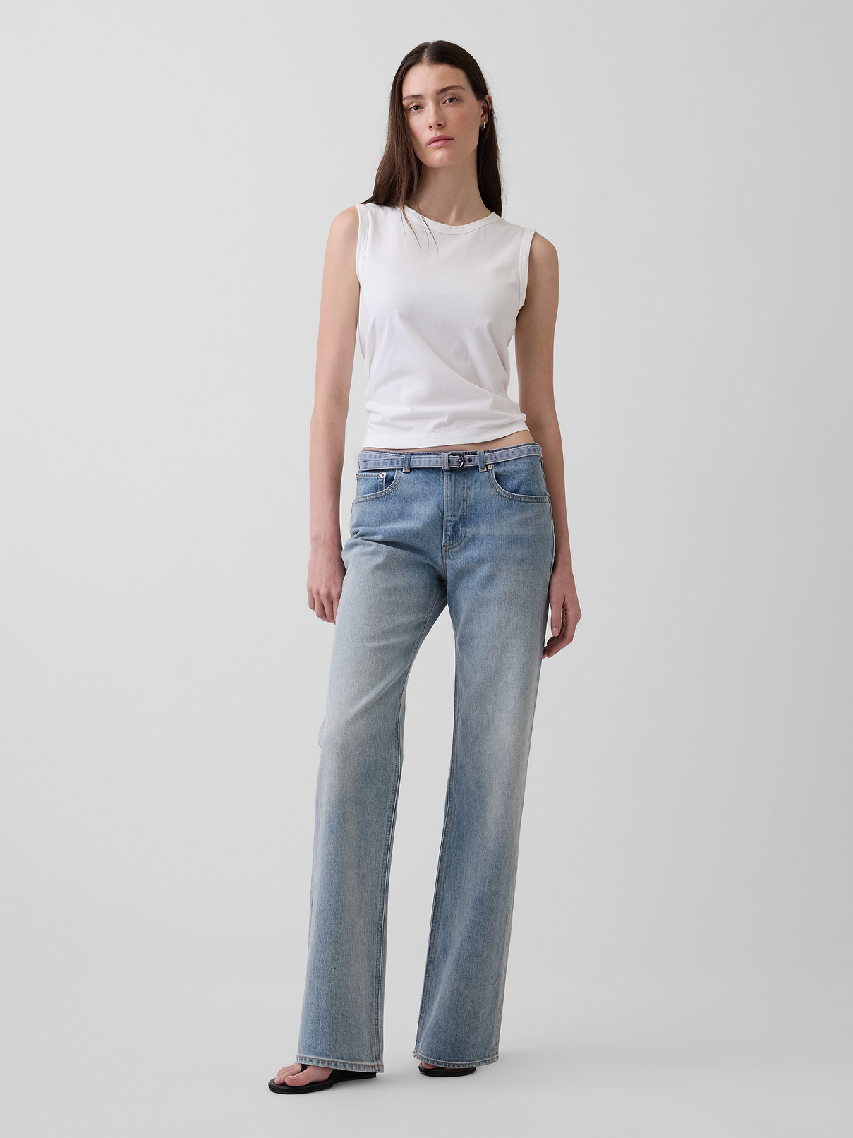 Image 1 of 6, Fit: A full-length jean that's fitted on the waist & straight all the way down., Fabric: 94% Cotton, 5% Recycled Cotton, 1% Stretch., Stretch: Low Stretch Jeans. Looks like vintage denim but feels like you've had them forever. Easy & comfortable with a little secret stretch., Rise: Mid Rise Jeans., Look: A relaxed straight jean in a light indigo wash., Details: Zip fly, five-pocket styling, & micro belt at waist., Responsibly Made: This pair of jeans is part of our Washwell program, which uses at least 20% less water as compared with conventional wash methods., More Sustainable Cotton: Made with 5% recycled cotton. Compared to virgin materials, using recycled materials helps reduce resource use and waste., Explore our GapJeans Guide ., This product was made in a factory that invests in gender equity and women’s empowerment through RISE. Learn more at gapinc.com/equity ., Product #893771