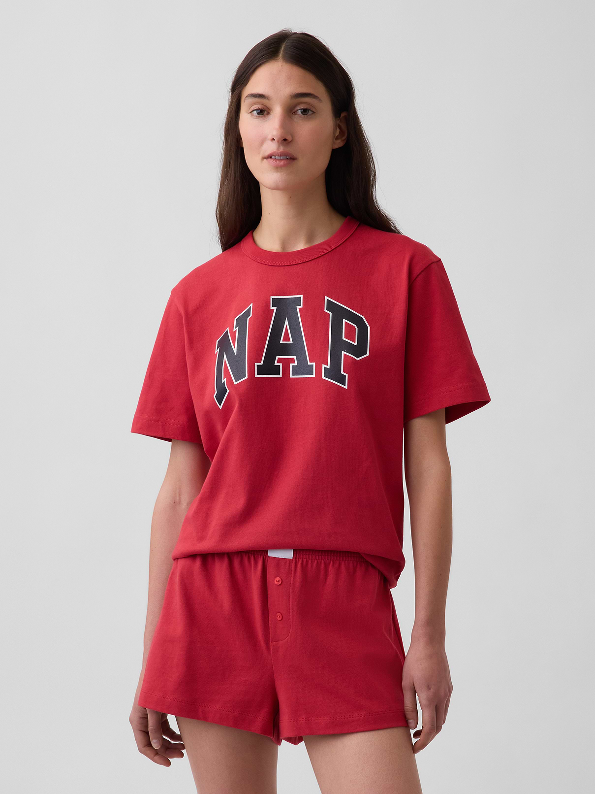 Image 1 of 7, Soft cotton jersey pajama T-shirt. In an oversized fit and tunic length., Crewneck., Short sleeves with drop shoulders., NAP logo at front., This product was made in a factory that invests in gender equity and women’s empowerment through RISE. Learn more at gapinc.com/equity ., Product #898502