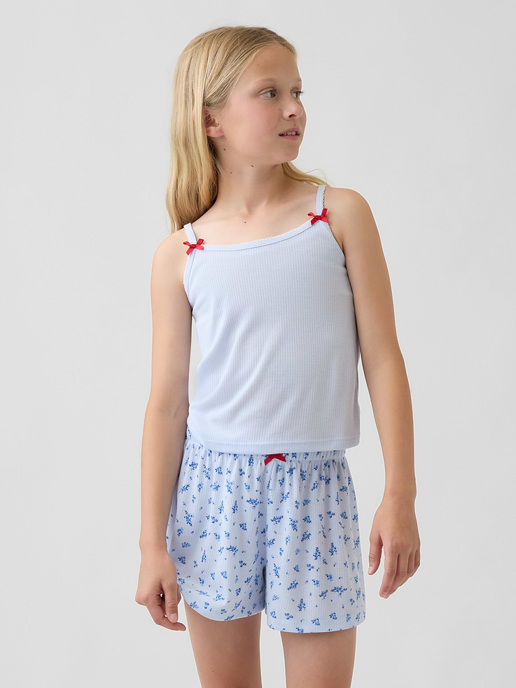 Image 1 de 4, Camisole de pyjama ajustée en tricot côtelé moiré doux., Encolure dégagée avec bordure à picots., Bretelles fines avec boucle en satin sur le devant., Certains modèles ont un imprimé de l’ourson Brannan sur le devant., Fait de polyester recyclé à 100 %. Comparativement aux matières vierges, l’utilisation de matières recyclées permet de réduire l’utilisation des ressources et le gaspillage., Ce produit a été fabriqué dans une usine qui investit dans l’égalité des genres et l’autonomisation des femmes grâce au programme Reimagining Industry to Support Equality (RISE). Pour en savoir plus, visitez gapinc.com/equite ., Produit #896946