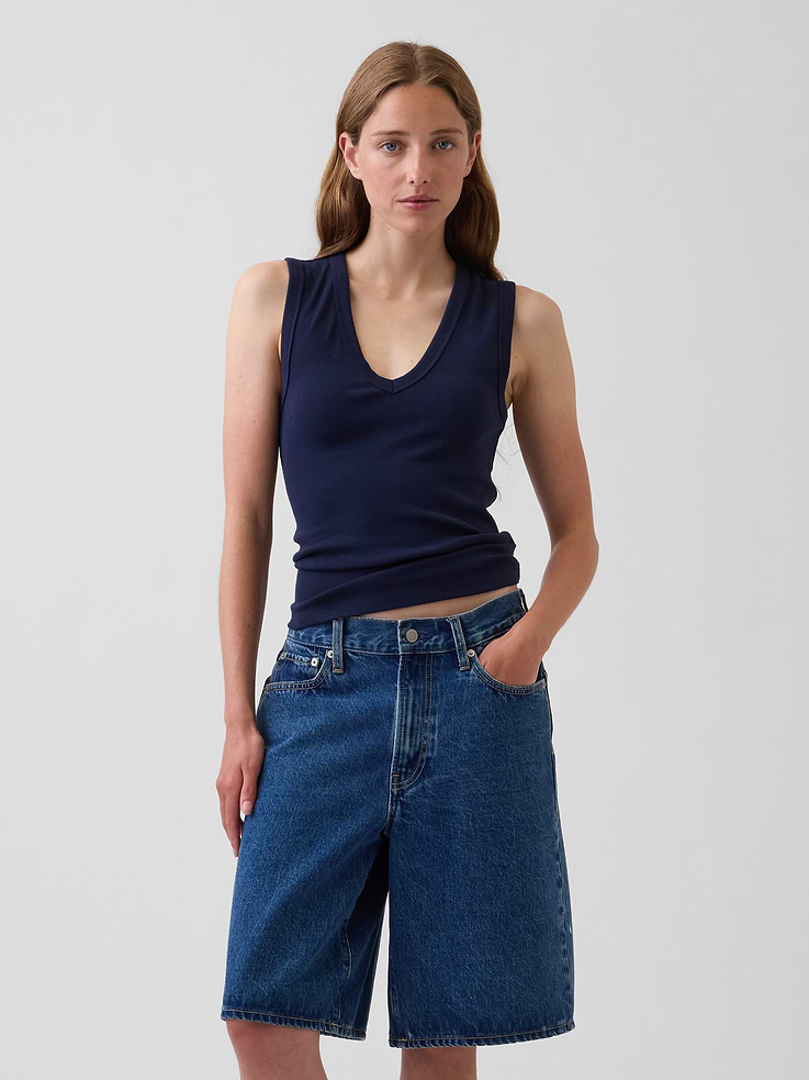 Image 1 of 5, Our soft & stretchy cotton-modal blend that hugs you just right. It’s your new 7-days-a-week essential., Soft, stretch modal-cotton blend tank top in a slightly cropped length., V-neck., Sleeveless., Explore our GapTees Guide ., This product was made in a factory that invests in gender equity and women’s empowerment through RISE. Learn more at gapinc.com/equity ., Product #886597